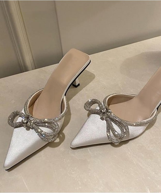 The white satin bow heels