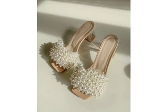 Beauty in bunch of pearl heels