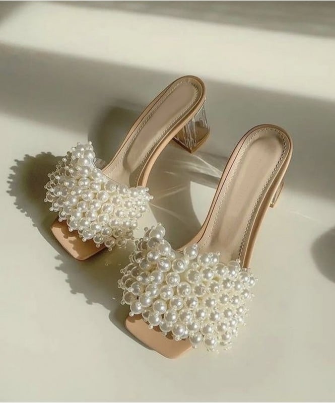 Beauty in bunch of pearl heels