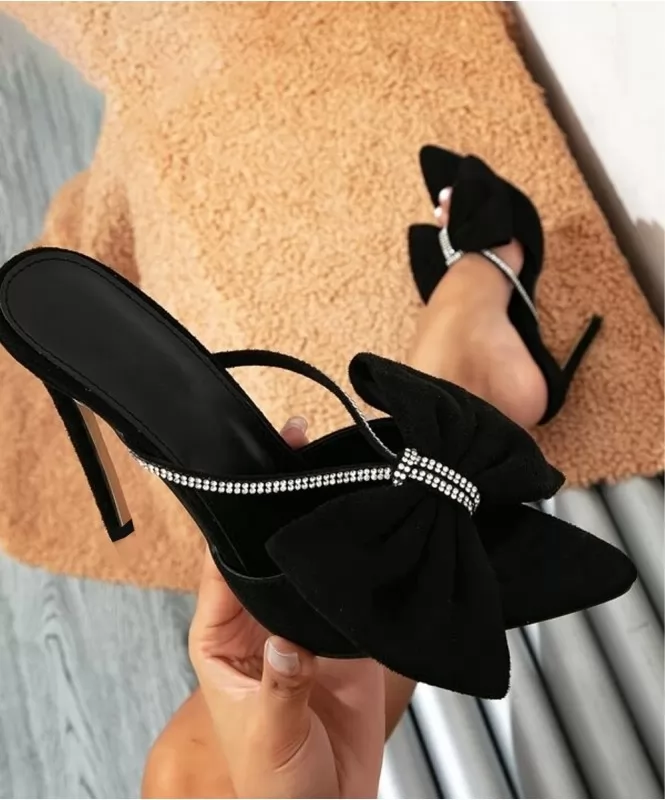 Black suede bow heels