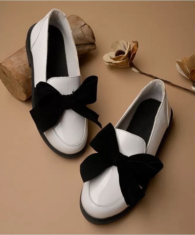 Black on white bow slip on