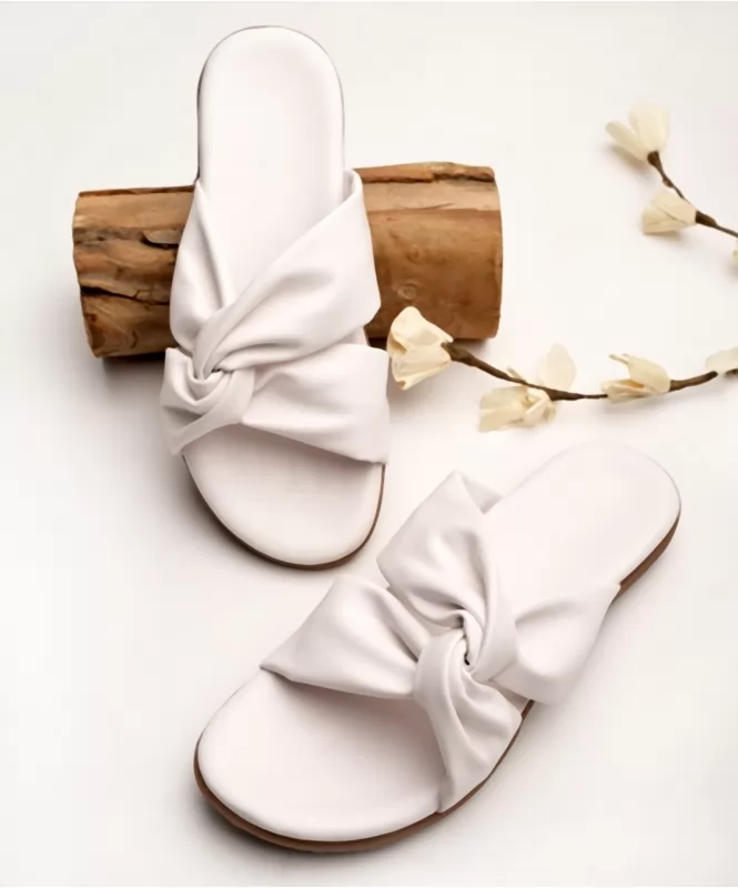 White twisted strap flats