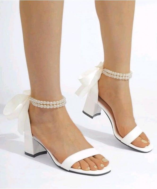 White pearl tie up heels 
